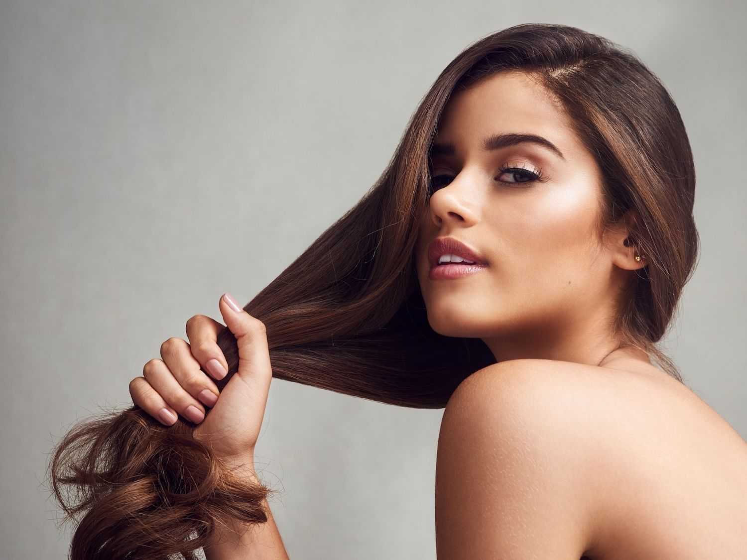 Woman showcasing her long, healthy hair.
